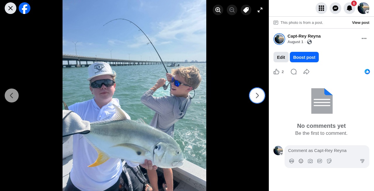 Kids celebrating a big catch together on the boat