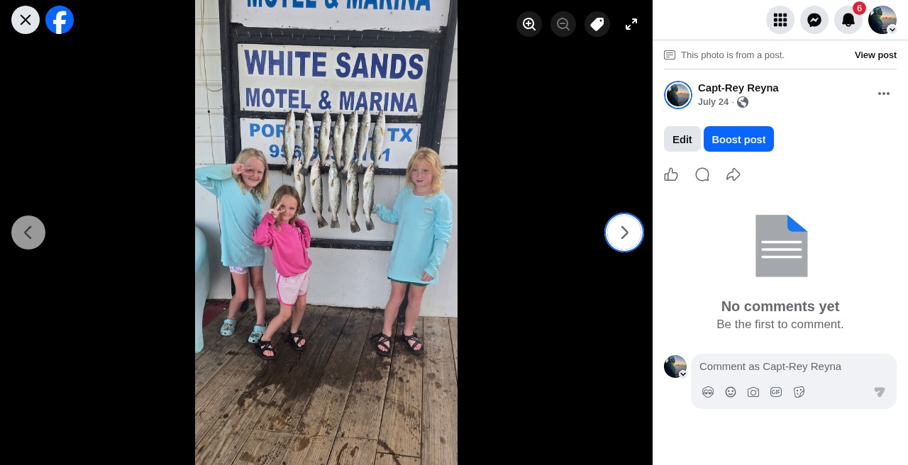 Kids showing off their fish after a family trip
